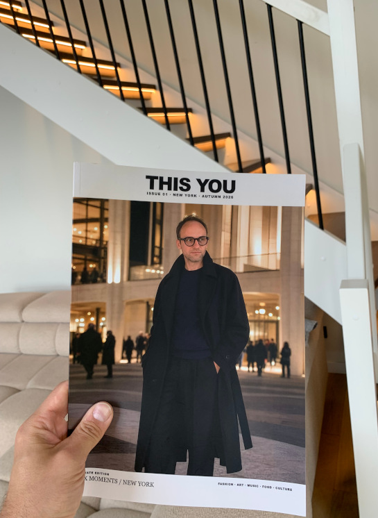 A physical copy of THIS YOU magazine held in hand